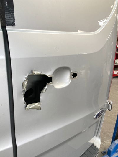 damaged side door of van