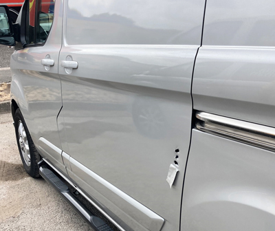 side door of silver van